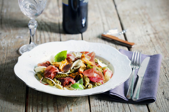 Gluten free pasta with mushrooms, prosciutto and sliced truffle
