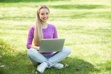 Beautiful young woman at garden