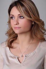 Portrait of a beautiful young woman looks into the distance