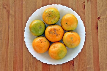 Asian orange or tangerine in white plate