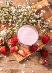Fresh milk, strawberry,drink on wooden table, assorted protein cocktail with fresh fruits. 