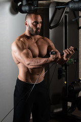 Fototapeta na wymiar Chest Workout With Cables