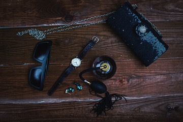 Women's accessories on wooden background