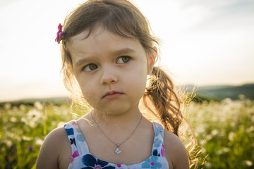 Portrait of five years old caucasian child girl sunset