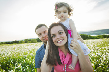 happy joyful family with daughter daisy field