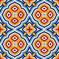 Bright ethnic abstract background. Seamless pattern with symmetric geometric ornament.