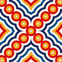 Bright ethnic abstract background. Seamless pattern with symmetric geometric ornament.
