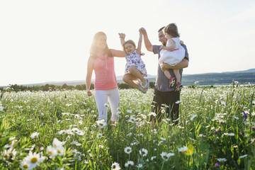 happy joyful fsther mother with daughters daisy field