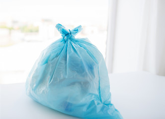 close up of rubbish bag with trash at home