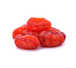Sun-dried cocktail tomatoes on white background