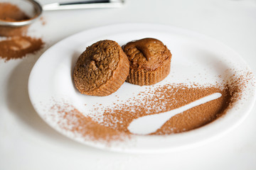 Freshly Baked Muffins On A White Plate