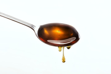 Honey on a spoon stainless steel