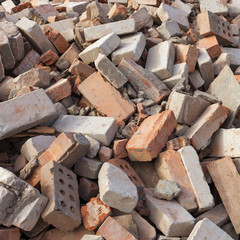 pile of ruined brick building after demolition