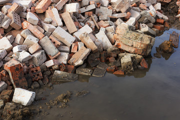 pile of ruined brick building after demolition