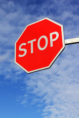 Bright road stop sign. Hanging side