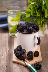 Fototapeta na wymiar blackberry in old cup