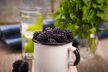 Fototapeta na wymiar blackberry in old cup