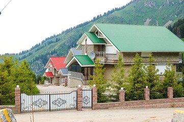 Modern stone houses on the banks of the river small Almaatinka Almaaty city, Republic of Kazakhstan, Ile Alatau