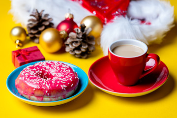 christmas decorations, cup of coffee and donut
