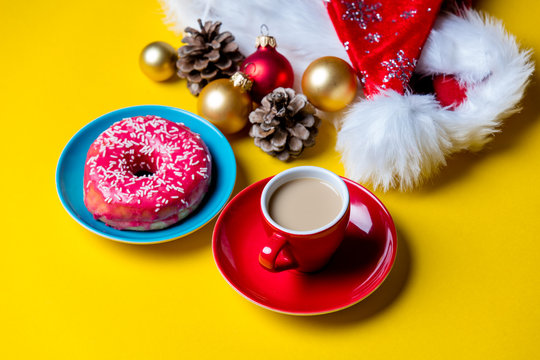 christmas decorations, cup of coffee and donut