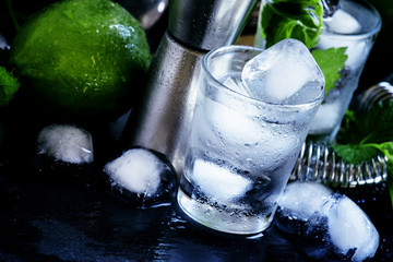 Making cocktails, bar tools, ice and alcohol, selective focus