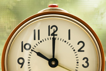 Time concept - orange alarm clock details