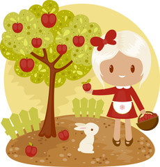 Fototapeta premium Little girl picking apples from apple tree