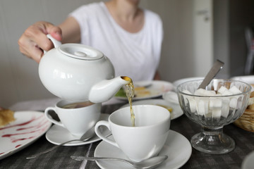 Woman pouring tea