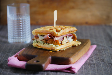 Waffle sandwich with prosciutto, chanterelles and cream cheese meal - 115818148