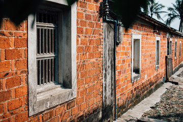 Old weathered street wall with windows. Selective Focus