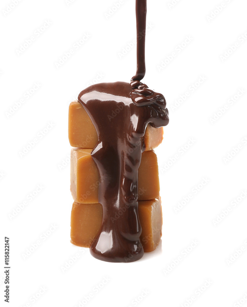 Poster melted chocolate with caramel candies, isolated on white