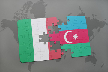 puzzle with the national flag of italy and azerbaijan on a world map background.