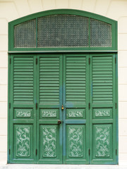 Green door traditional style of Thai temple