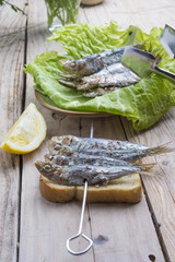 Sandwich with sardines, sprats with parsley and dill