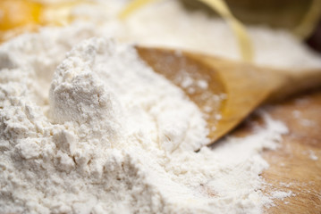 Flour and Egg on the wooden table at a kitchen