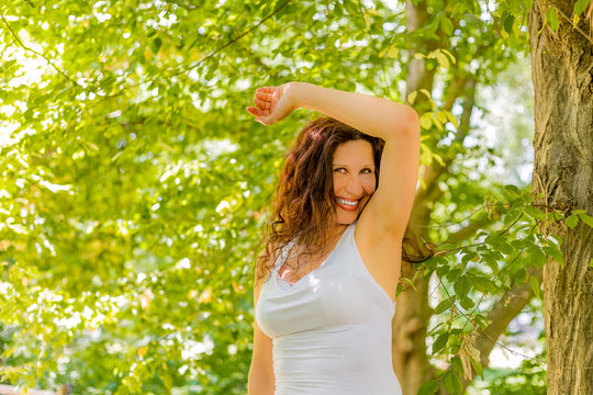 Menopausal Woman Sniffs Armpits