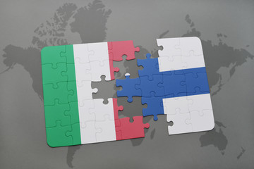 puzzle with the national flag of italy and finland on a world map background.