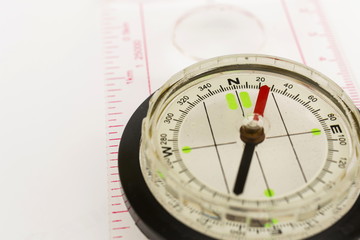 Detail shot of a glass compass on white background