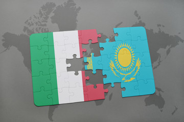 puzzle with the national flag of italy and kazakhstan on a world map background.