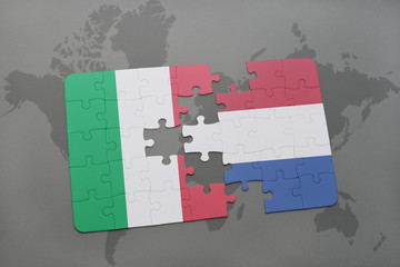 puzzle with the national flag of italy and netherlands on a world map background.