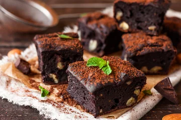 Foto auf Acrylglas chocolate brownie with nuts © yuliiaholovchenko