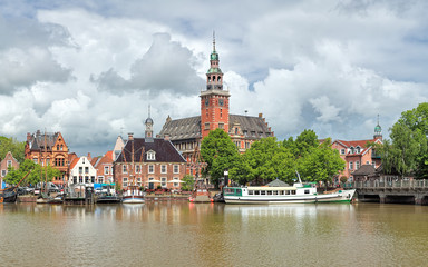Leer, Germany. View from Leda river on the City Hall in Dutch Renaissance style, the Old Weigh...