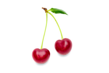 Two cherry with leaves isolated on white background.