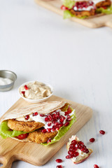 an appetizing falafel on the cutting board