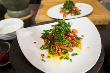 Stir fried duck spicy with crispy basil,