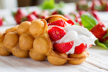 waffles with strawberries and whipped cream