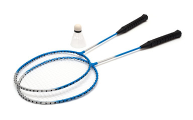 child's hand holding a badminton racket on a white