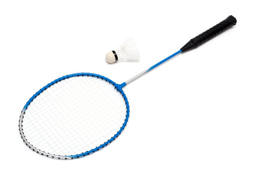 child's hand holding a badminton racket on a white