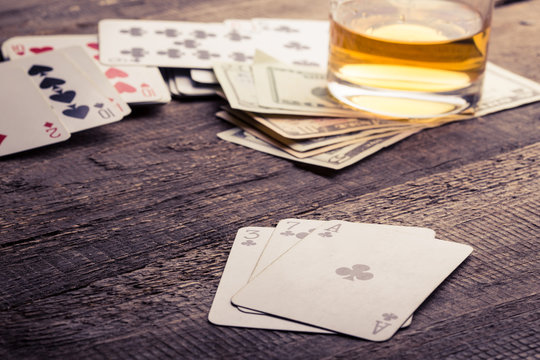 cards, whisky and money