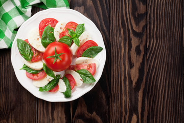 Caprese salad. Mozzarella, tomatoes and basil